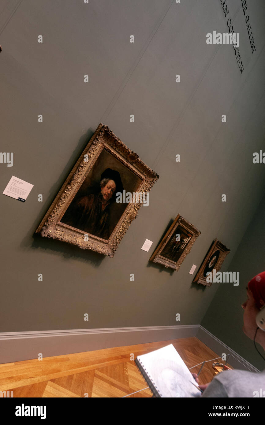 Visitor listening the audio guide of SelfPortrait by Rembrandt , The Metropolitan Museum of Art