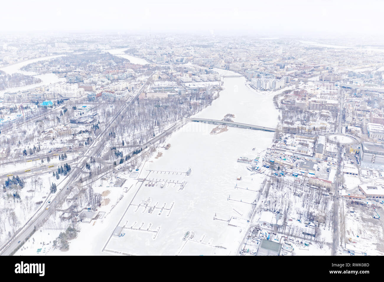 Winter city. High key aerial panoramic view in Saint Petersburg, Russia with frozen river and distant skyline Stock Photo
