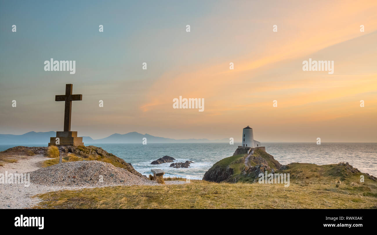 Sunset at Twr Mawr lighthouse, Llanddwyn Island, Anglesey looking out to southern entrance of the Menai Strait. Classic UK landscape photograph. Stock Photo