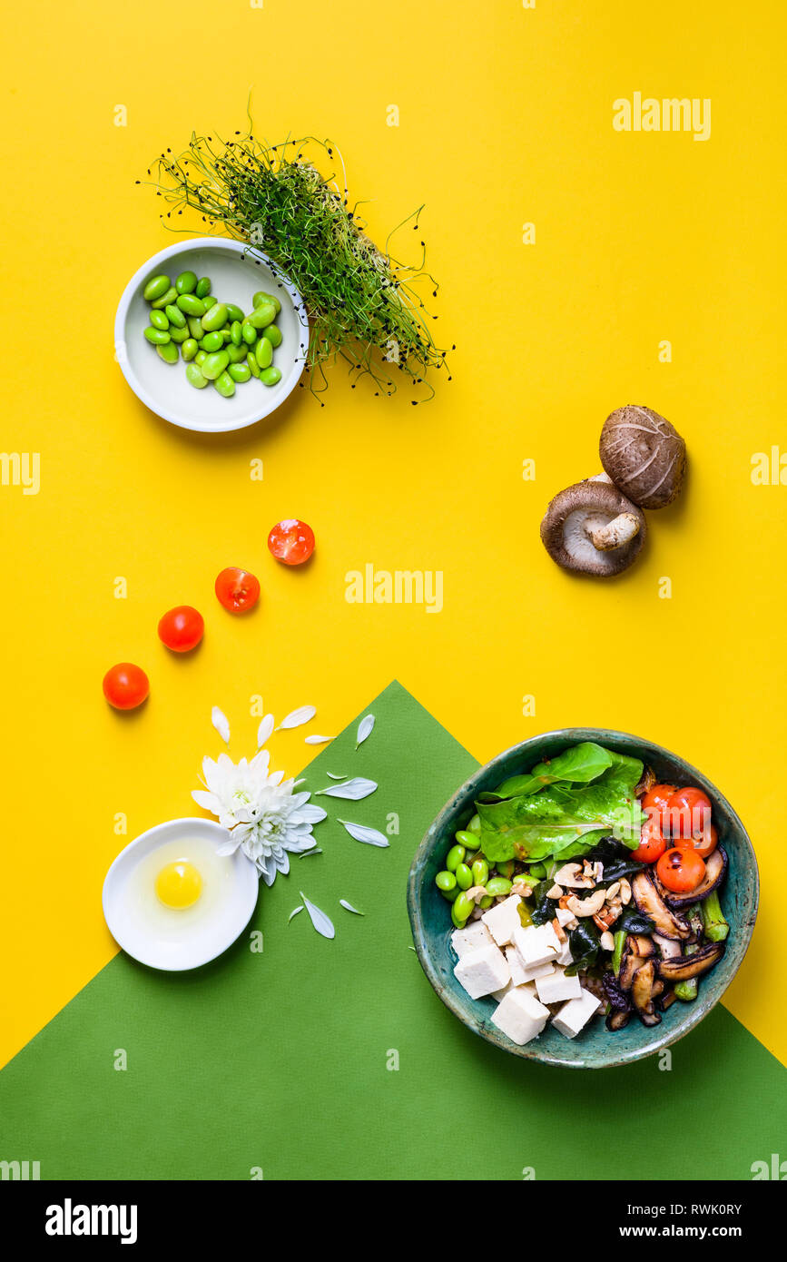 Hawaiian vegetarian poke bowl with tofu, shiitake mushrooms and edamame