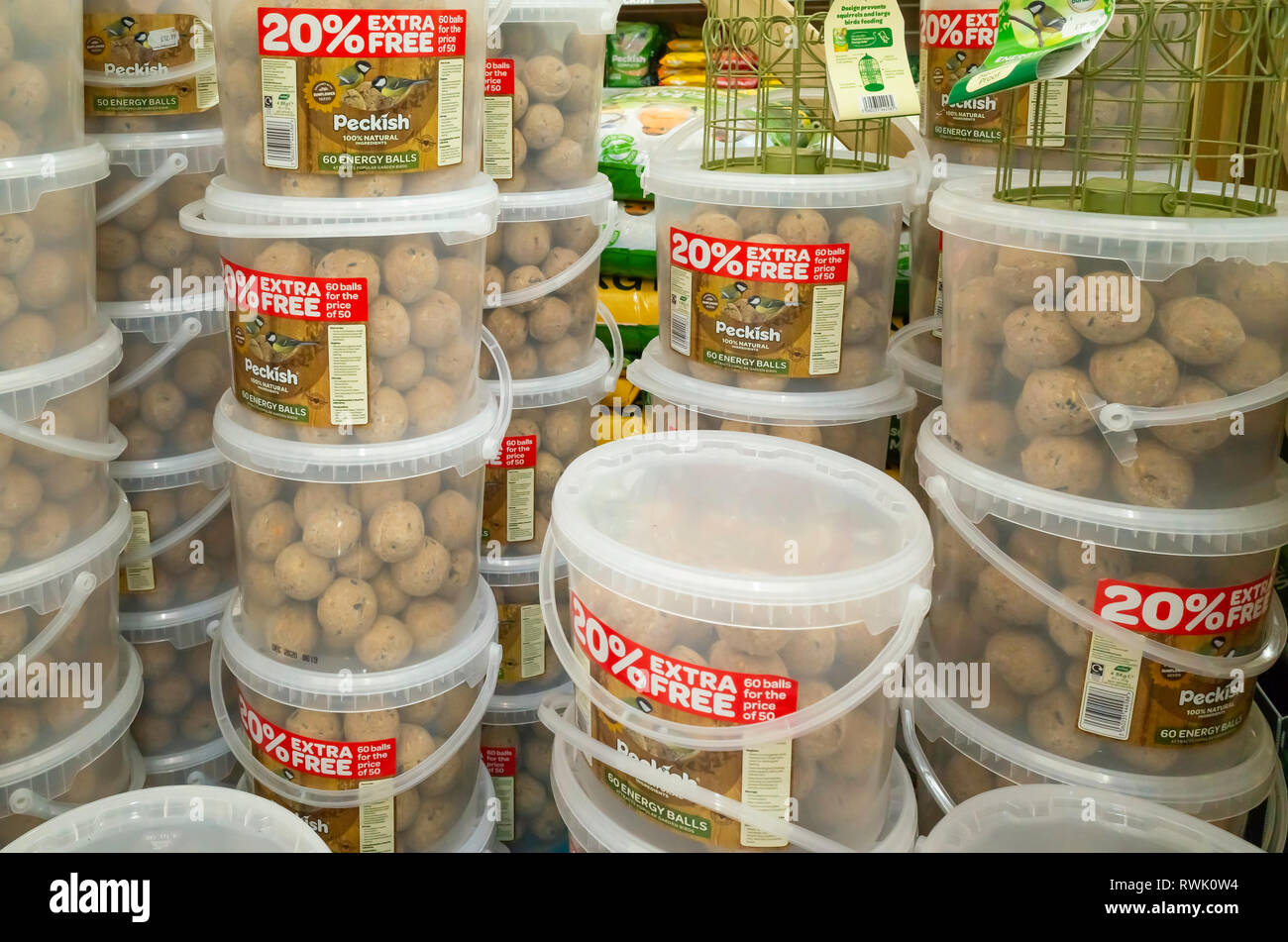 Garden Centre display of tubs of Peckish brand fat balls for attracting