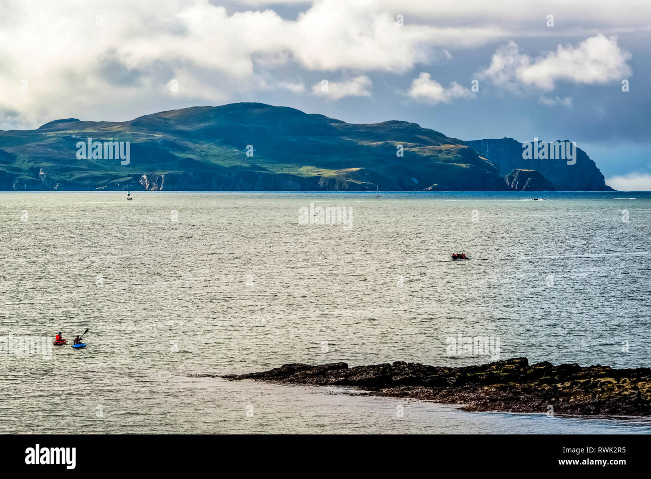 Kayaks and a boat in Sheephaven Bay; Downings, County Donegal, Ireland Stock Photo