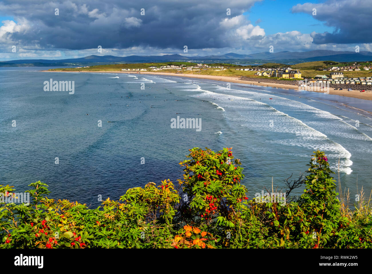 Surfing along the coast of Northern Ireland; Rossnowlagh, County Donegal, Ireland Stock Photo