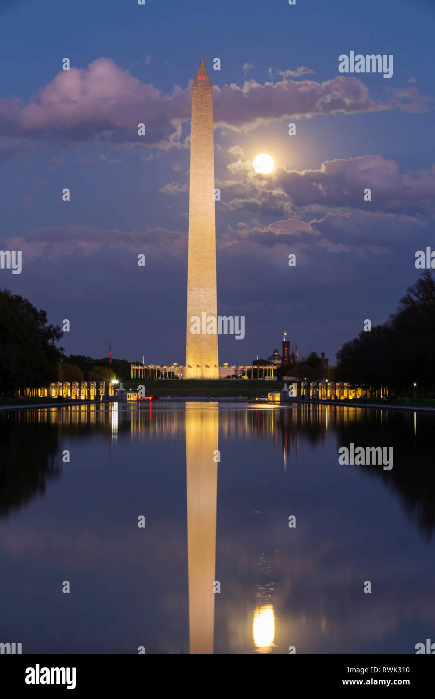 Washington Monument taken from Lincoln Monument at dusk with moon shining brightly; Washington D.C., United States of America Stock Photo