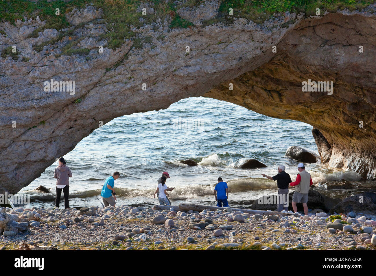 One of three archways carved out of a limestone rock formation by the pounding of the surf and accessible by foot at low tide. North of Parson's Pond, Western Newfoundland, Canada Stock Photo