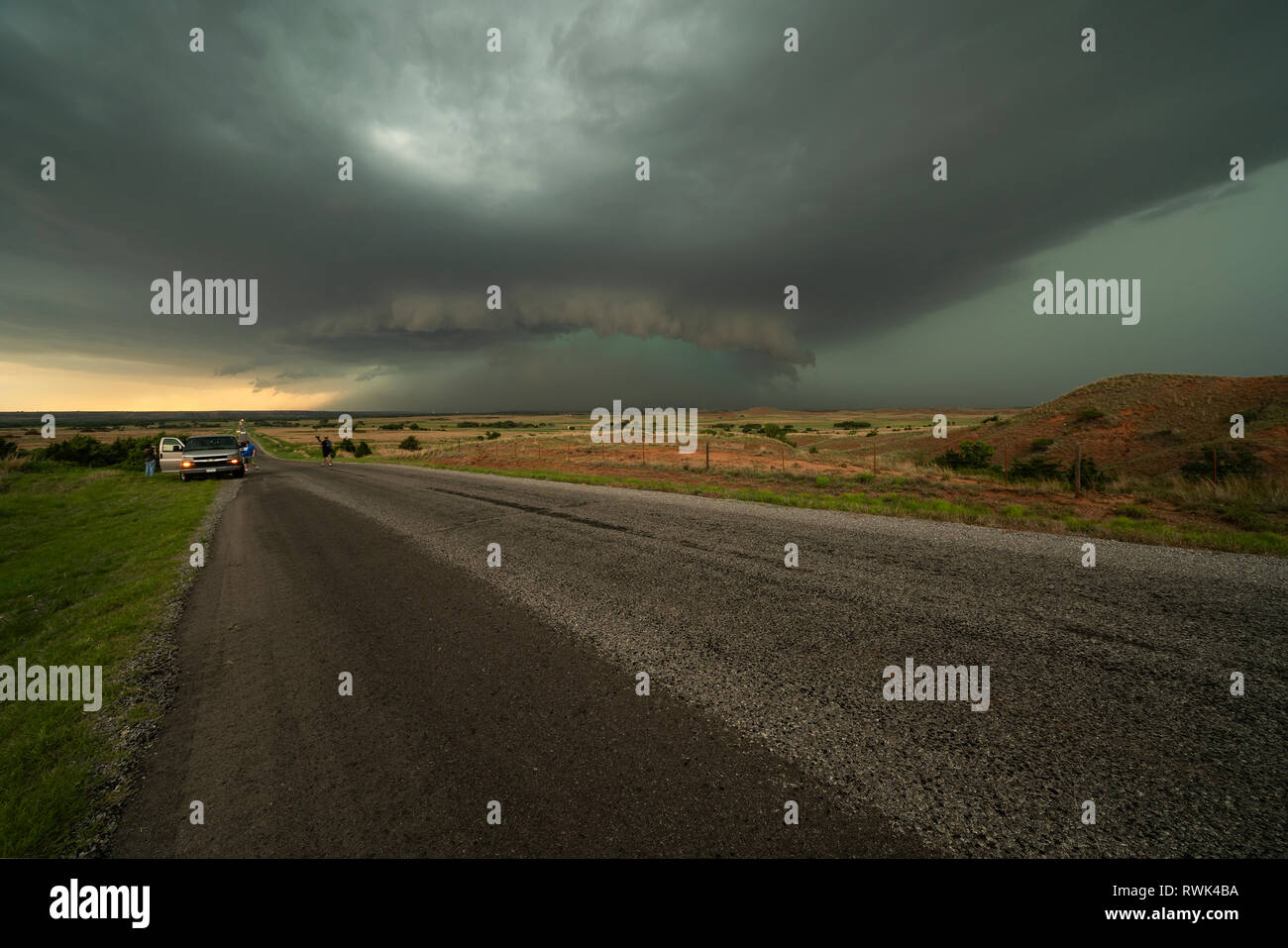 Watching a supercell thunderstorm while on a tornado chasing tour; Oklahoma, United States of America Stock Photo