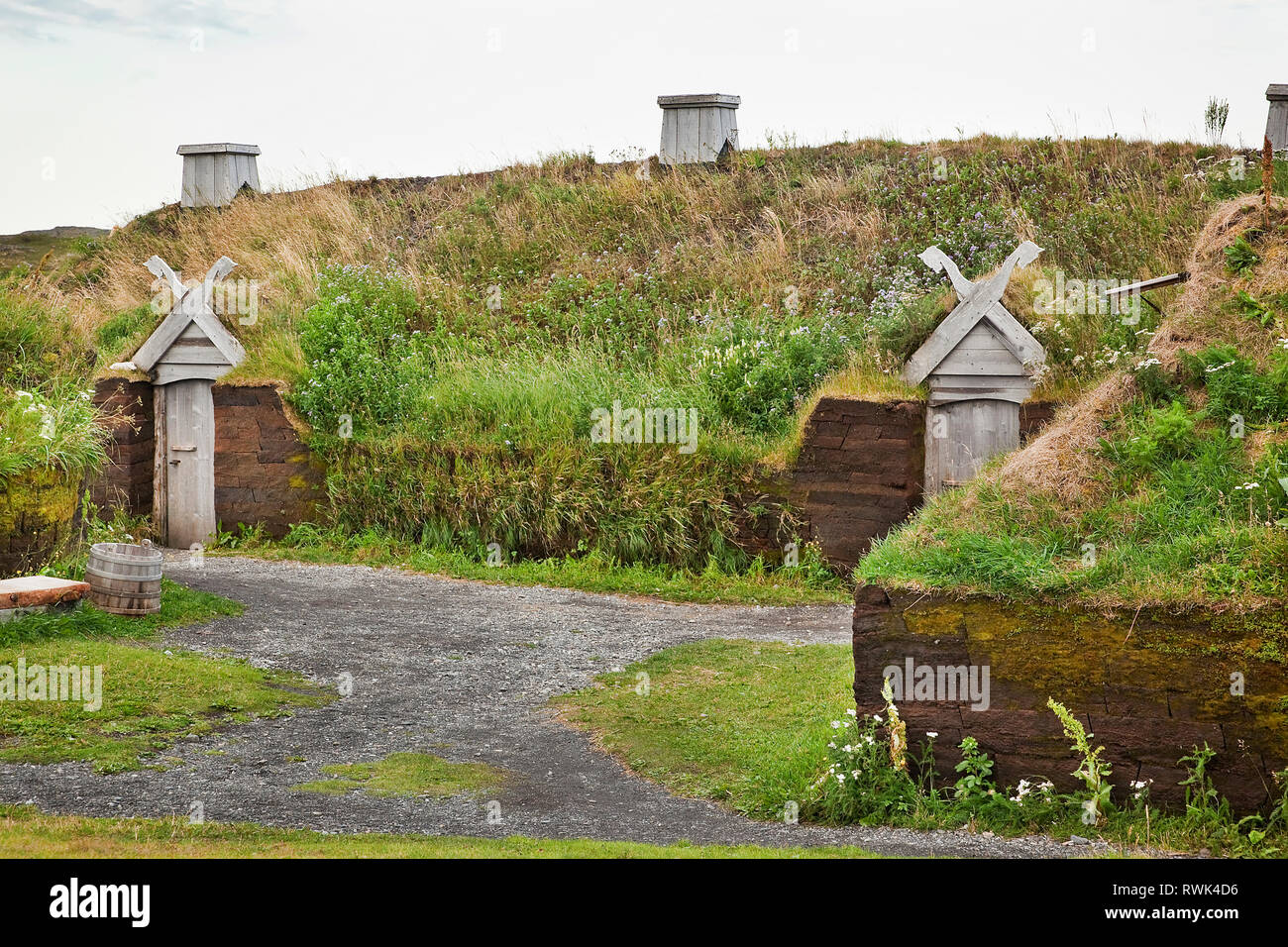 Exterior of a recreated Viking longhouse with its characteristic sod roof and peat block walls. L'Anse aux Meadows National Historic Site, L'Anse aux Meadows, Newfoundland, Canada Stock Photo