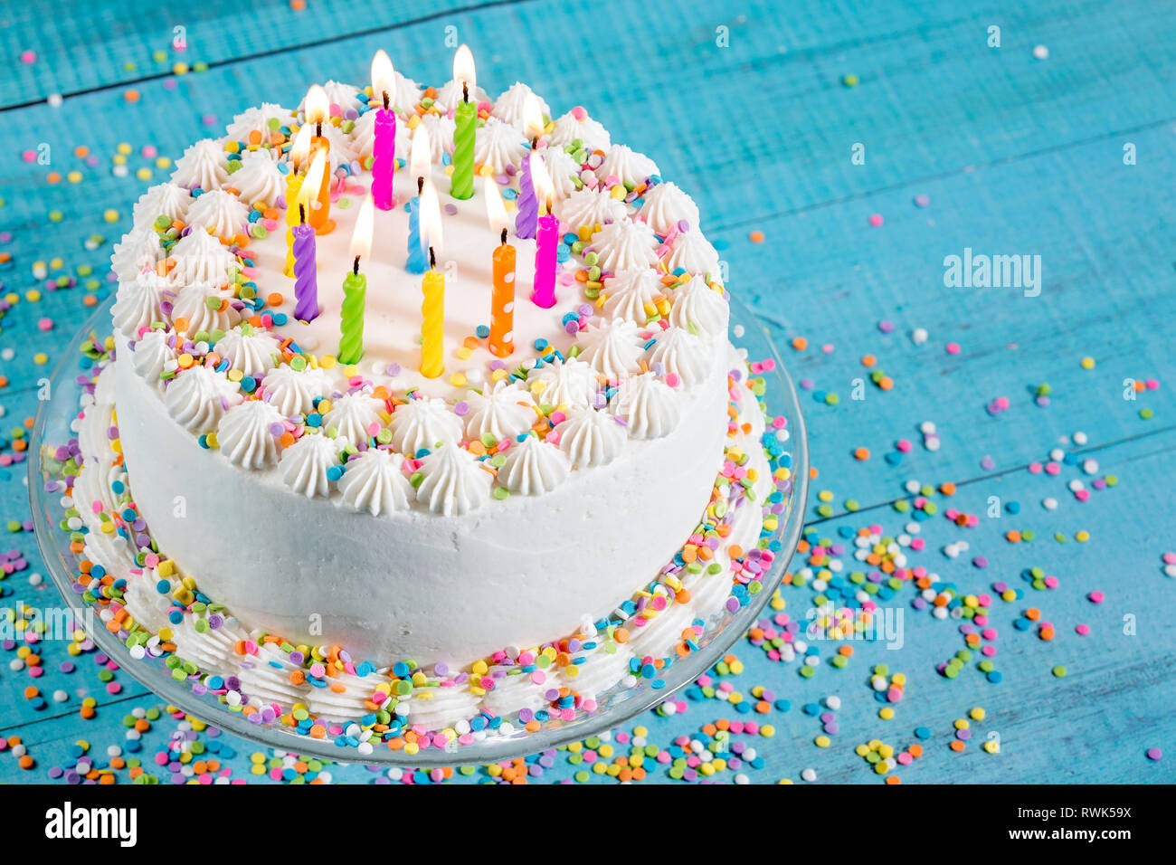 White Buttercream icing birthday cake with with colorful sprinkles and ...