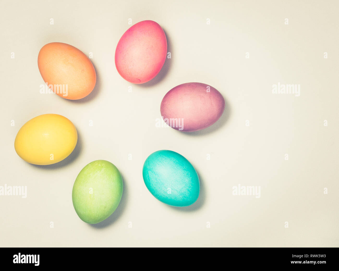 Colourful Easter Eggs background with antique vintage toning effect. Stock Photo