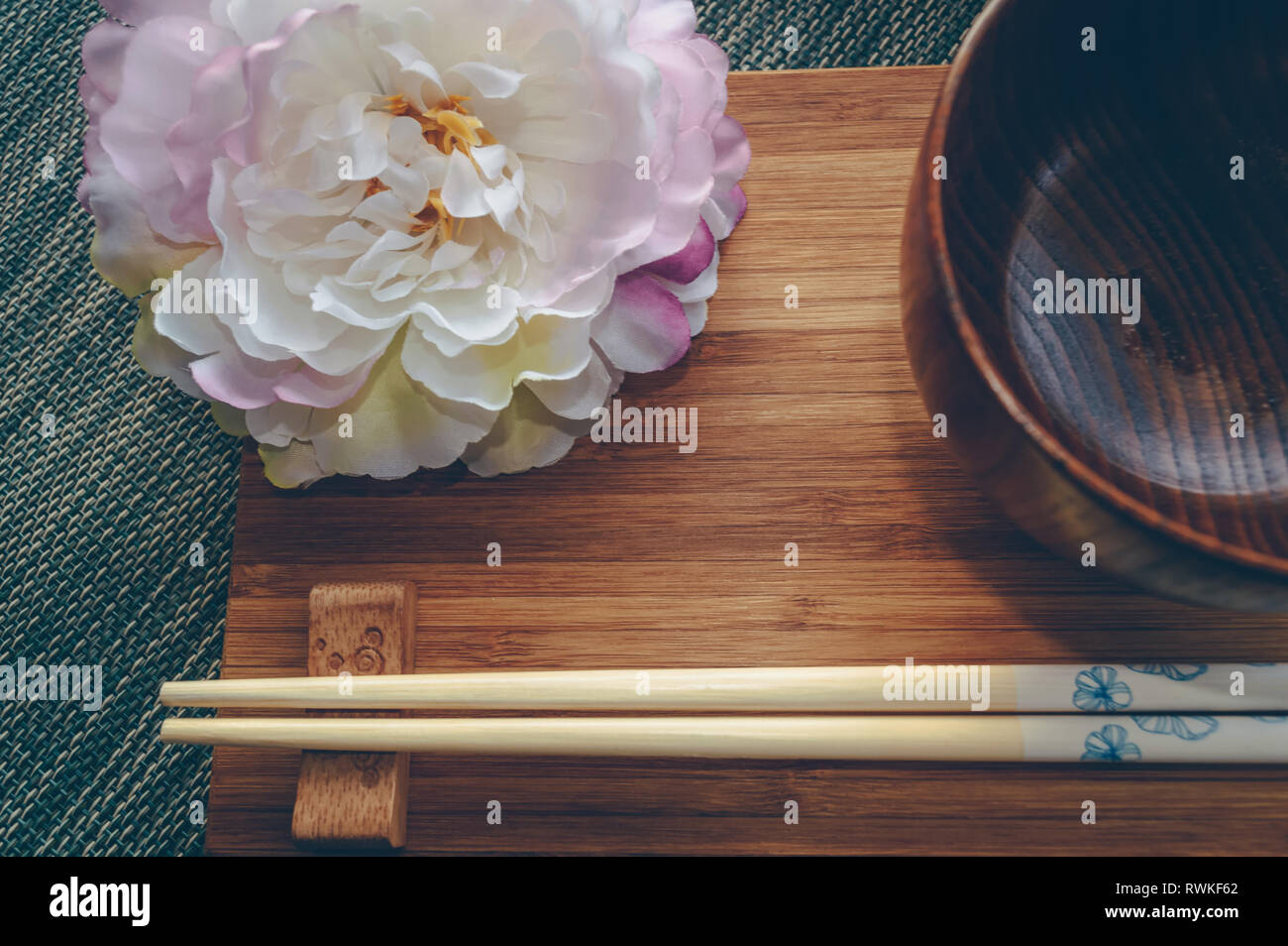 close up view of japanese styled tablewear and peony flower decor Stock Photo