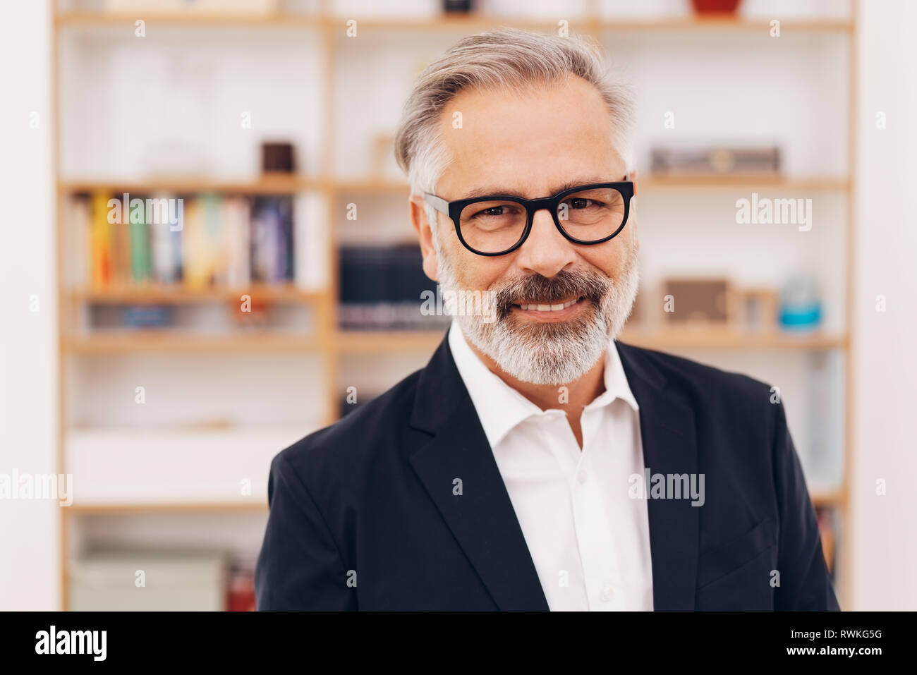 Senior Bearded Professional Man In A Smart Suit Standing In An