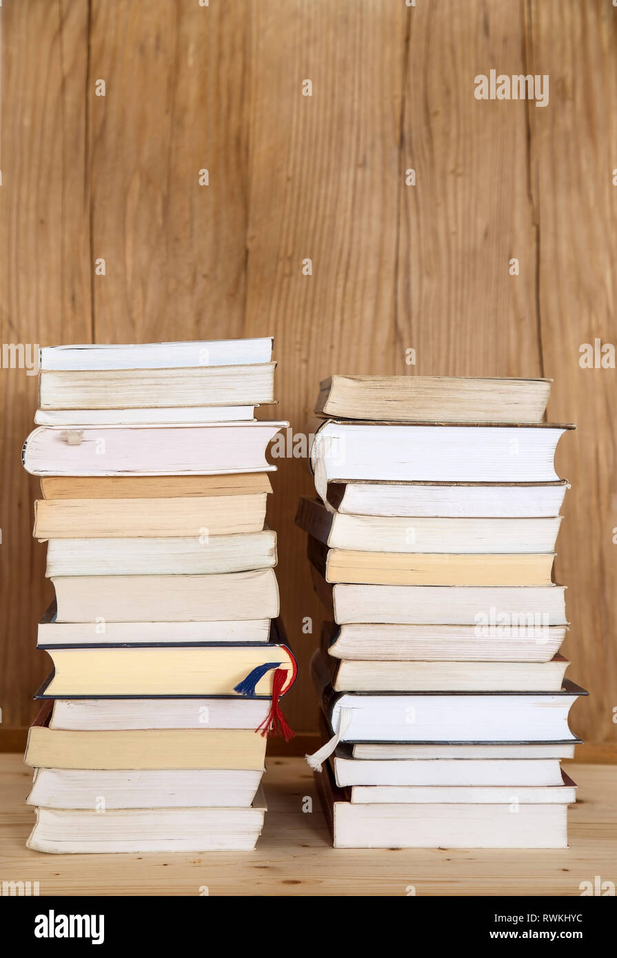 Stack of books on wooden background Stock Photo