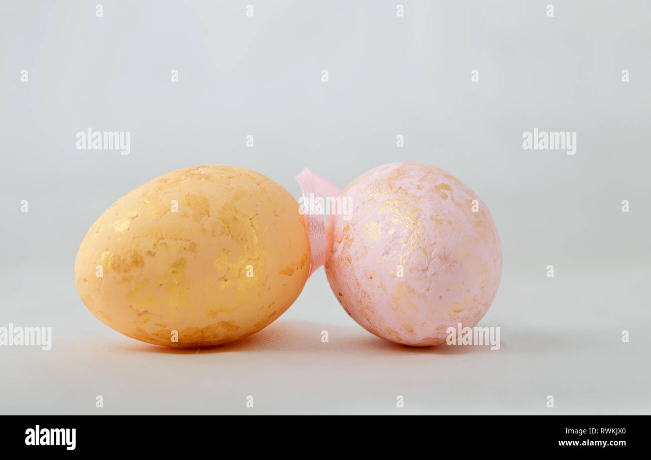 Golden painted easter eggs on  white background Stock Photo