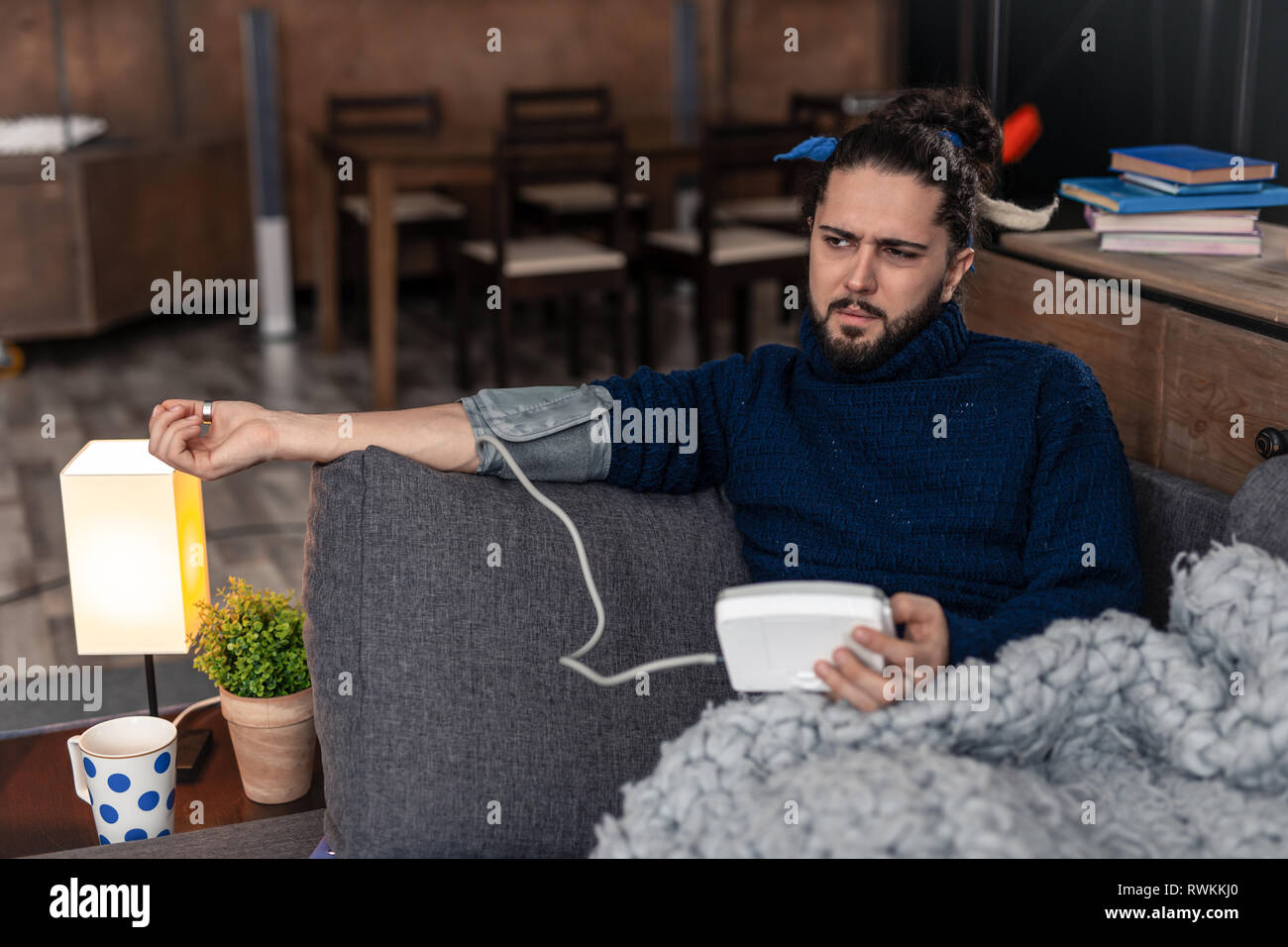 Nice young man holding a special device Stock Photo
