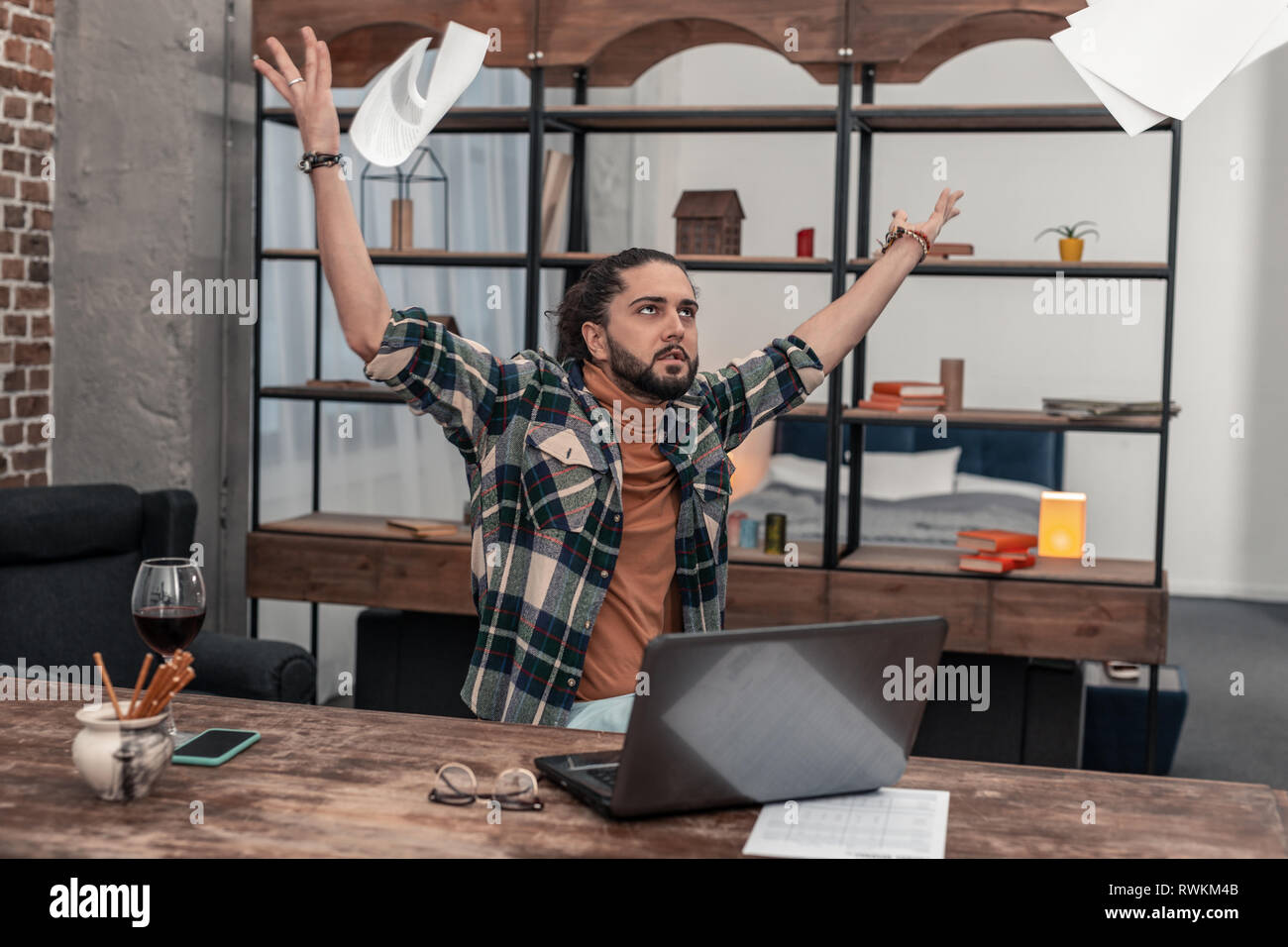 Sad depressed man being tired from work Stock Photo