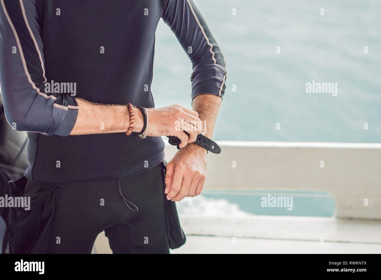 Young diver preparing an underwater compass for diving Stock Photo Alamy