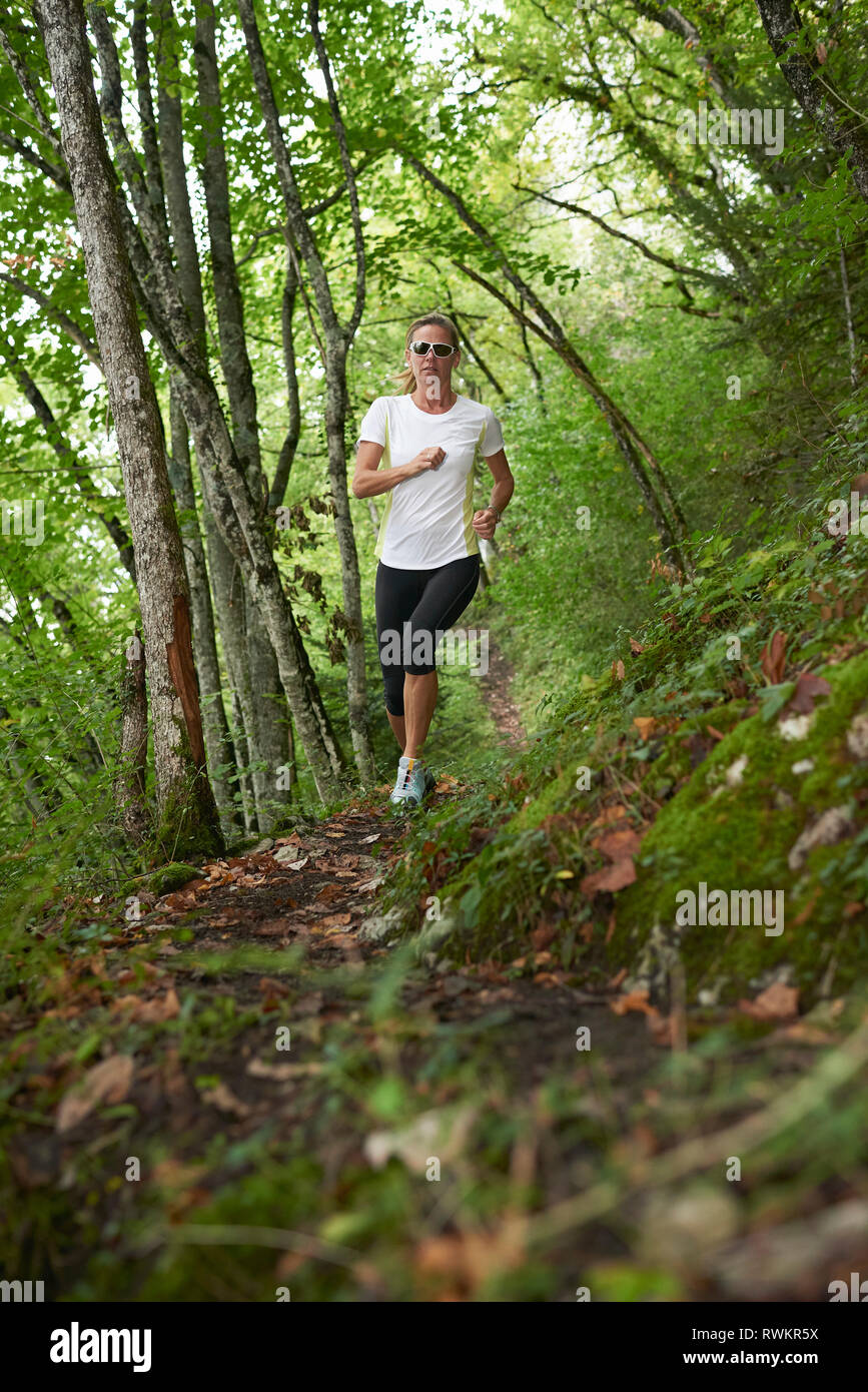 Jogger in forest Stock Photo