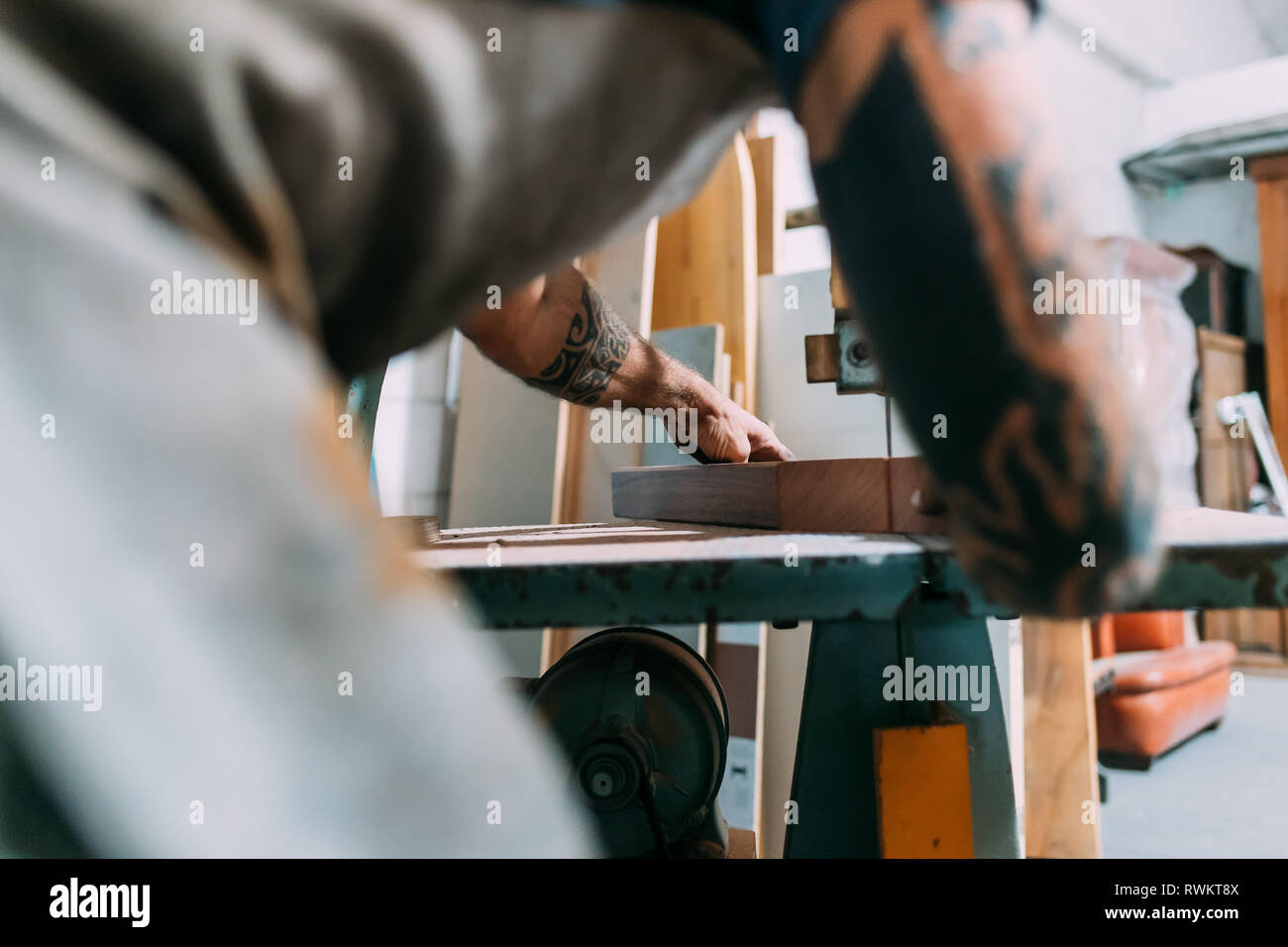 Axe working on wood for axe handle in workshop Stock Photo
