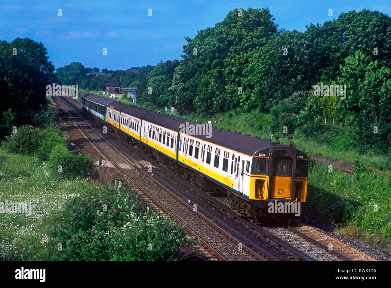 A pair of class 421 4-CIG units numbers 1739 in Connex South Central livery and 1831 in freshly applied Southern livery forming a down service at Stoats Nest Junction near Coulsdon. 21st August 2002. Stock Photo