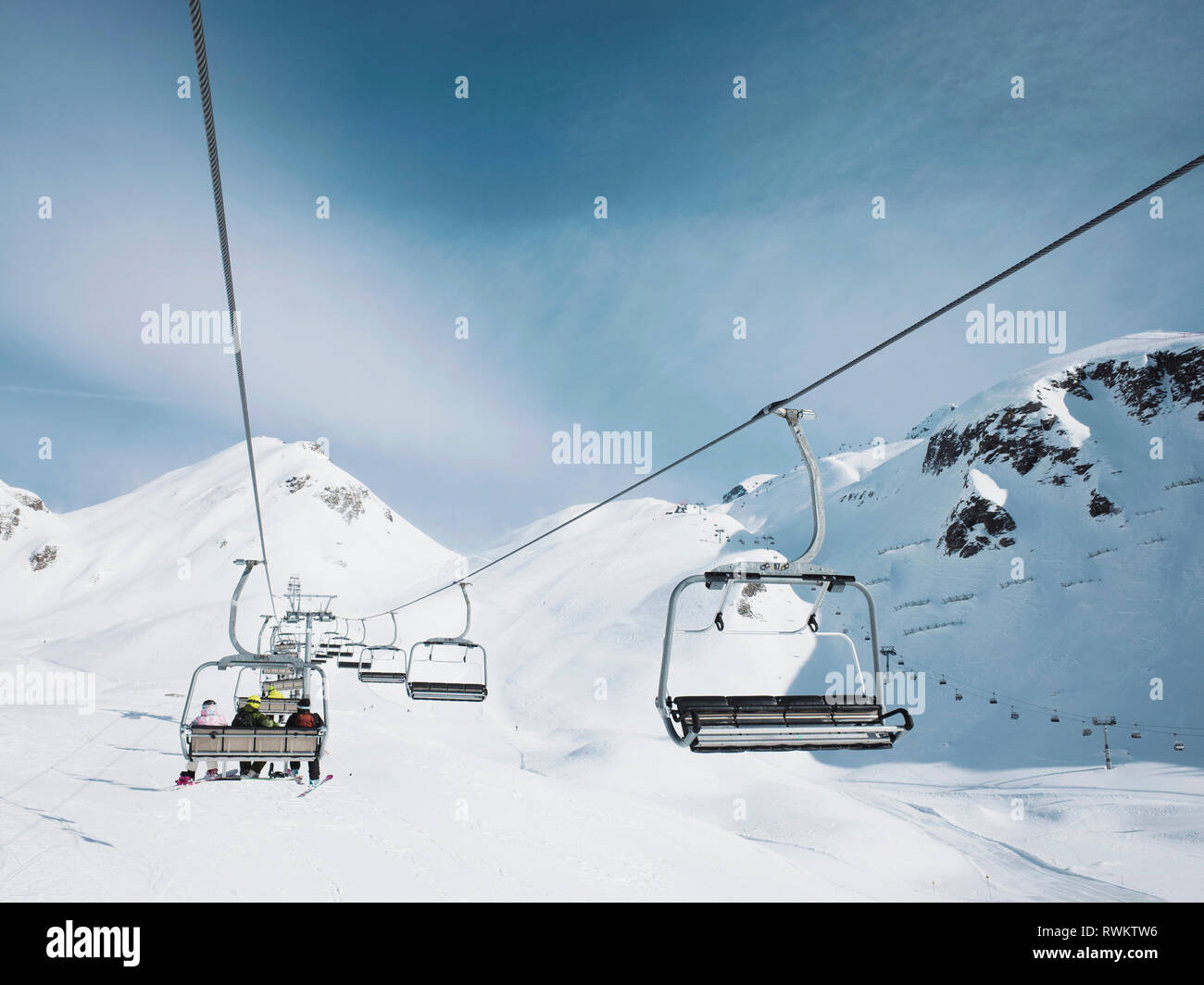 Ski lift in snow covered mountain landscape,  Alpe Ciamporino, Piemonte, Italy Stock Photo