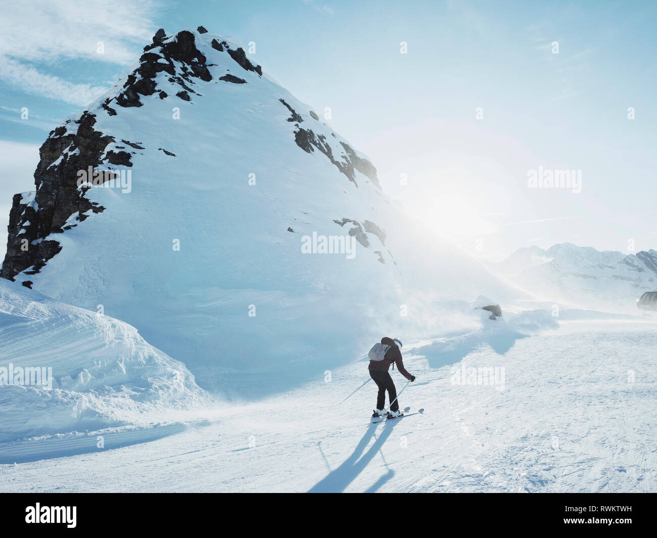 Young female skier skiing in snow covered landscape,  Alpe Ciamporino, Piemonte, Italy Stock Photo