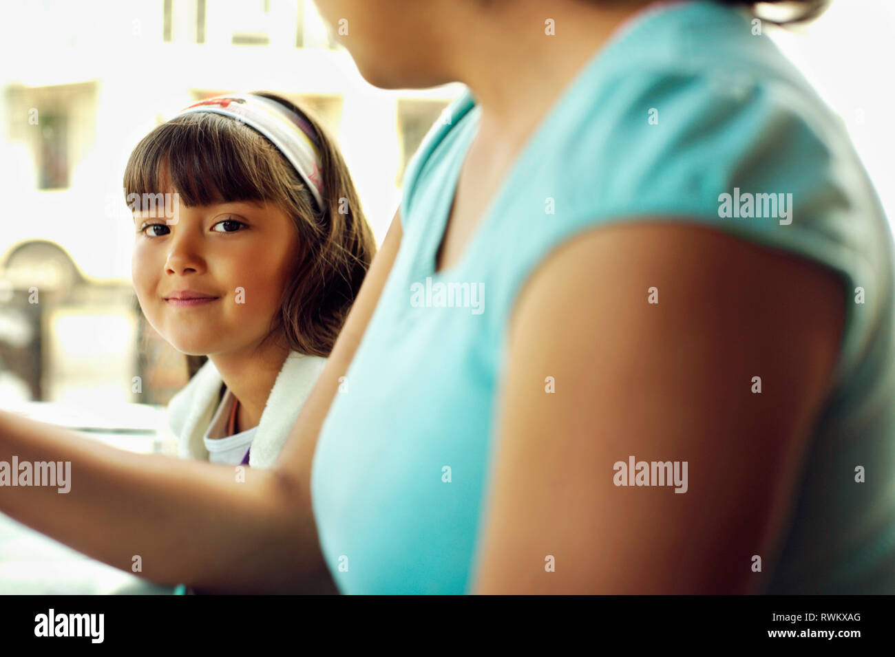 Young girl wearing a headband smiles. Stock Photo