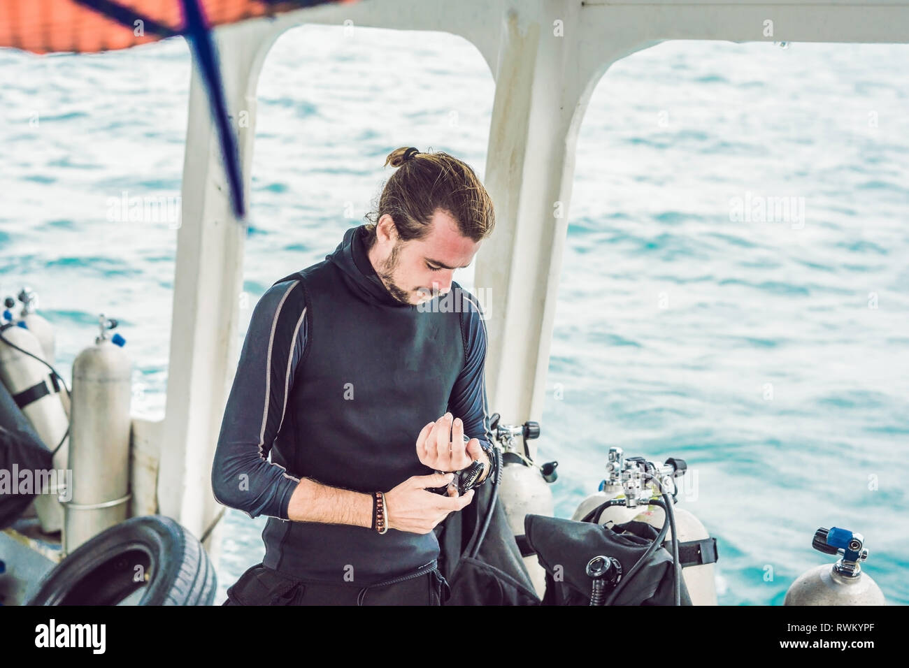 Young diver preparing an underwater compass for diving Stock Photo Alamy