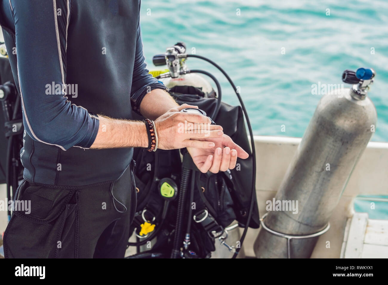 Young diver preparing an underwater compass for diving Stock Photo Alamy