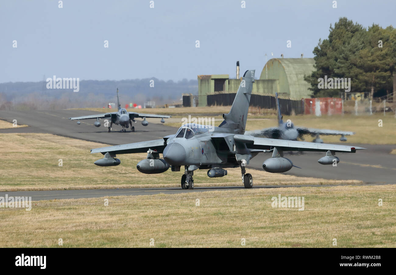 Three Tornado GR4 aircraft taxiing out to the runway at RAF Marham airbase, Norfolk, UK, during the farewell events before the type's retirement. Stock Photo