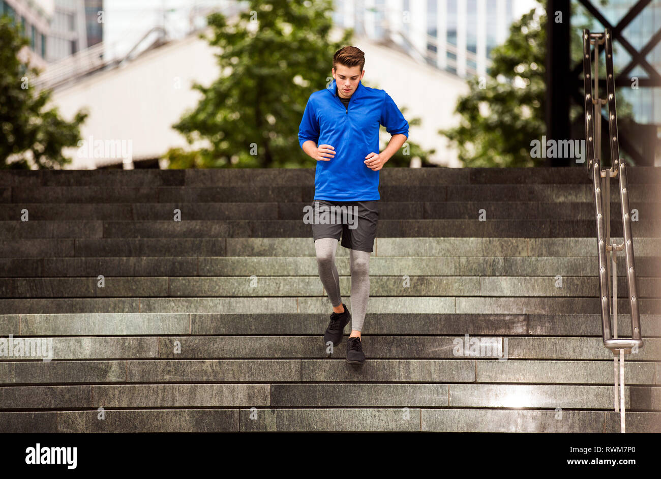 Young runner jogging down steps, London, UK Stock Photo Alamy