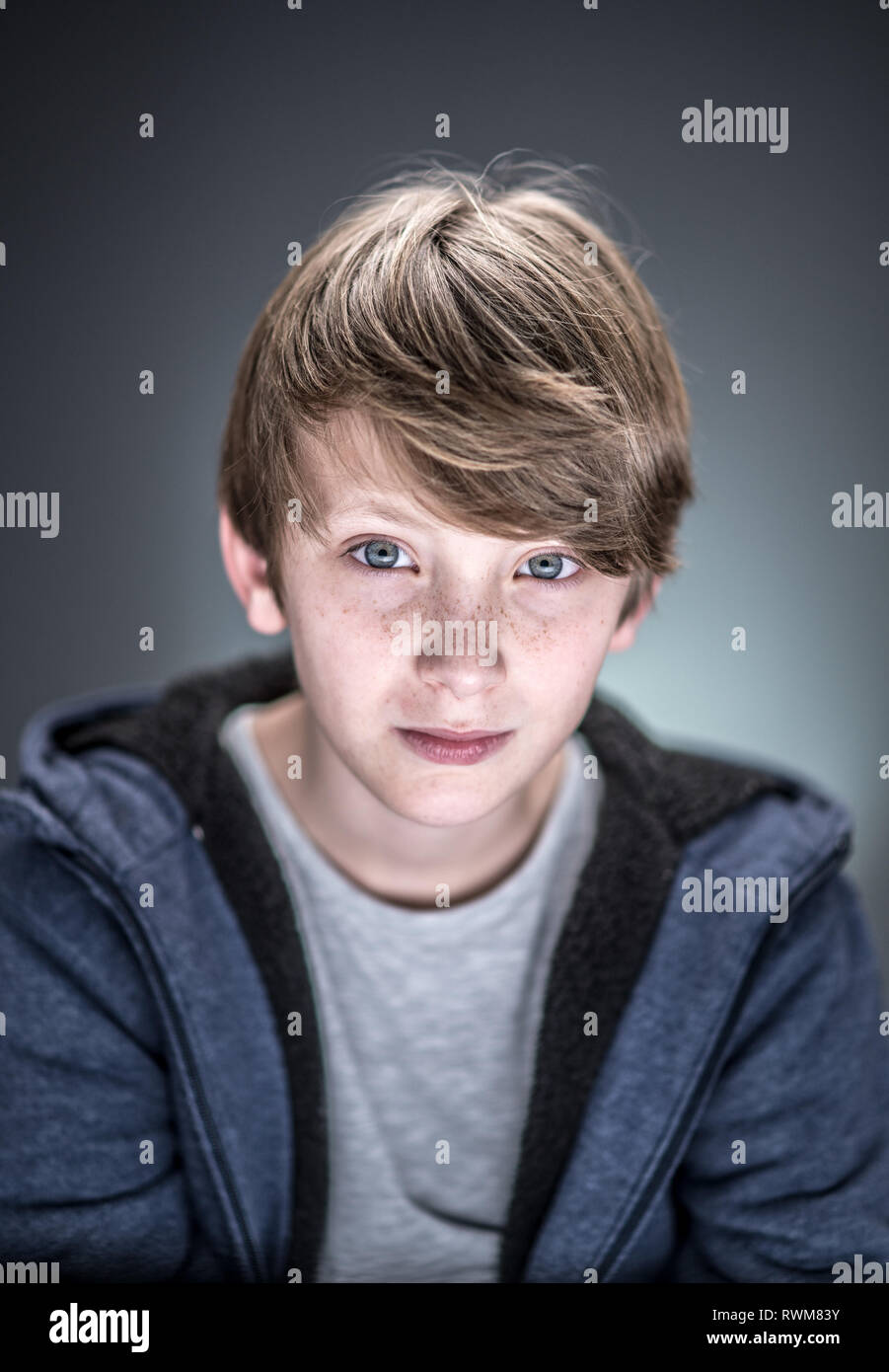 Studio portrait of a handsome and expressive young caucasian boy Stock Photo