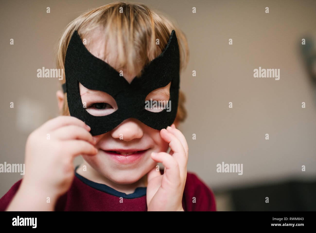 Boy in costume mask Stock Photo