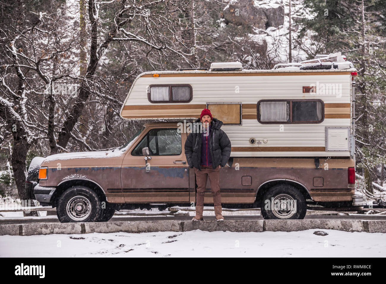 Climber beside campervan, Yosemite National Park, California, USA Stock