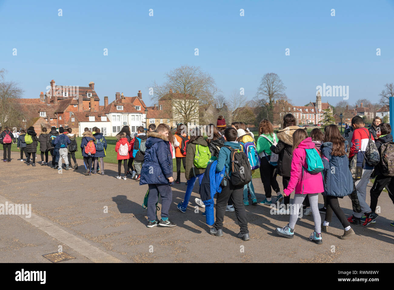 Salisbury, Wiltshire, England, UK. February 2019. Visiting students on Cathedral Close within the grounds of Salisbury Cahedral. Stock Photo