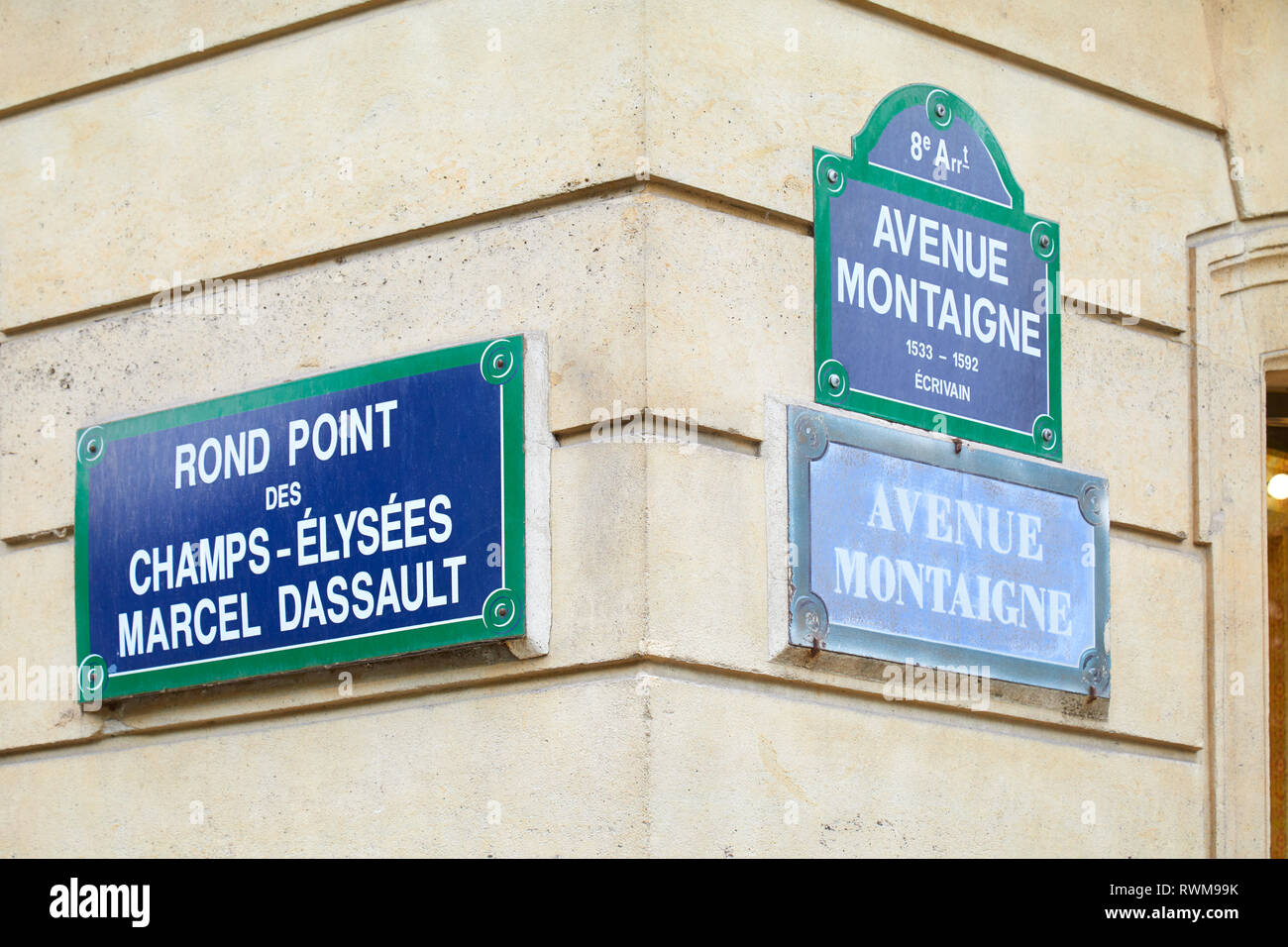 PARIS, FRANCE - JULY 22, 2017: Famous Champs Elysees and Avenue Montaigne corner and street signs in Paris, France. Stock Photo