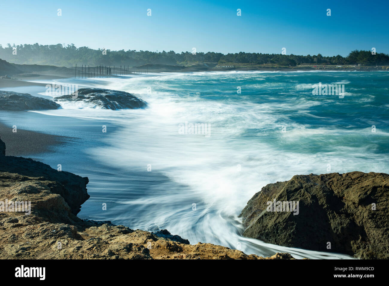 Waves softened by a long exposure surge onto the beach at MacKerricher State Park and Marine Conservation Area near Cleone in Northern California Stock Photo