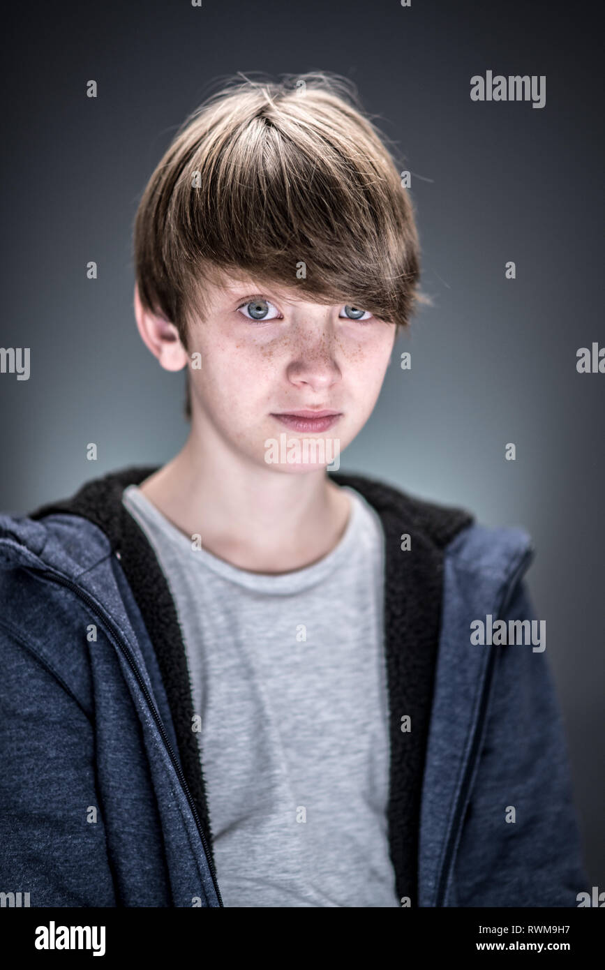 Studio portrait of a handsome and expressive young caucasian boy Stock Photo