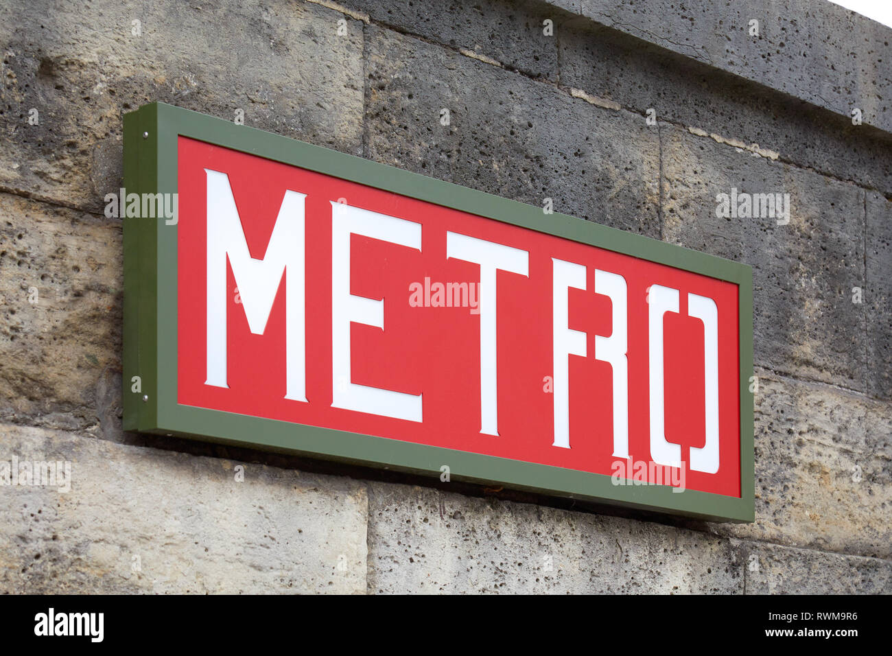 PARIS, FRANCE - JULY 22, 2017: Metro sign red and green on wall in Paris, France. Stock Photo