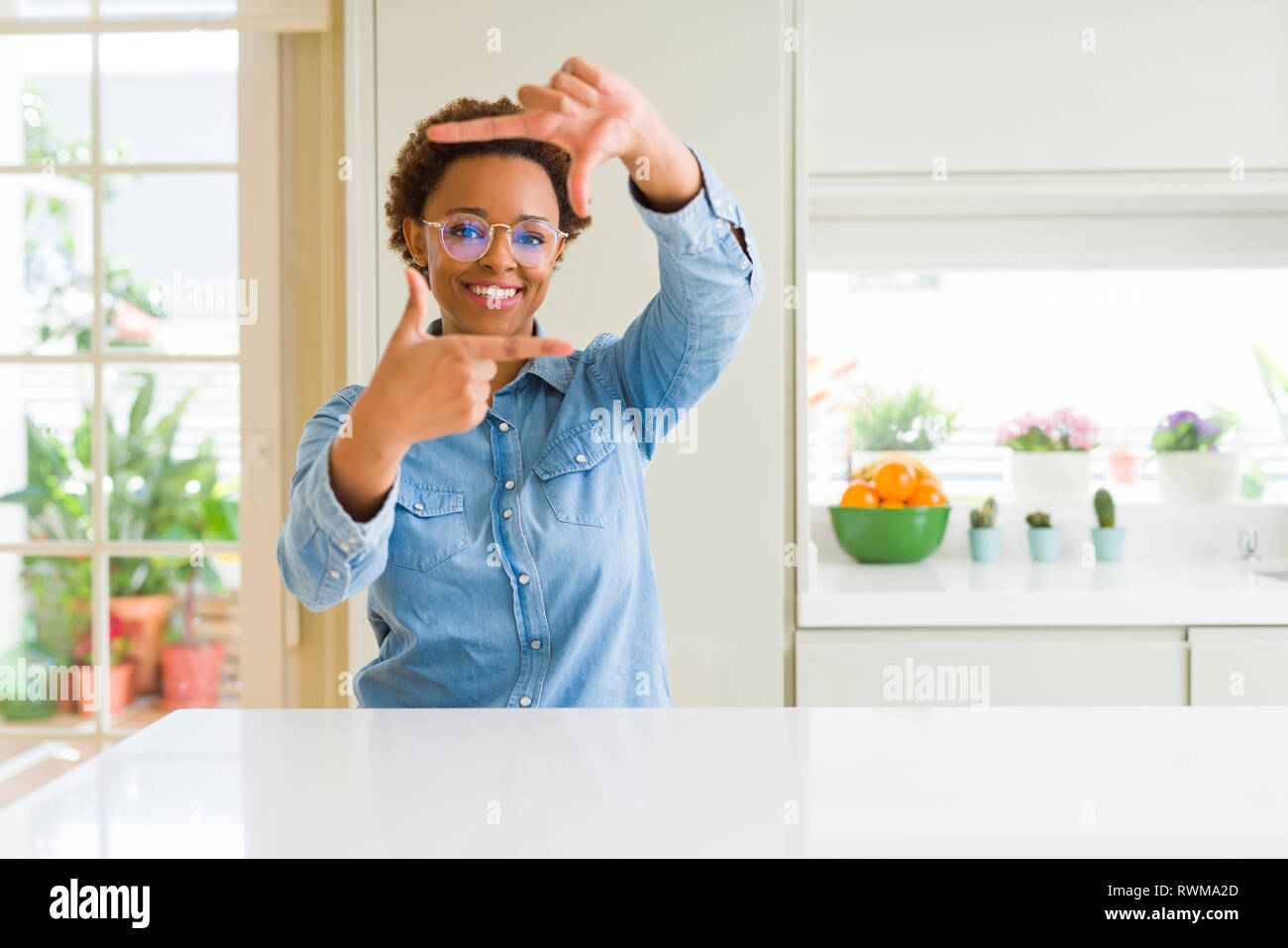 Young beautiful african american woman wearing glasses smiling making ...