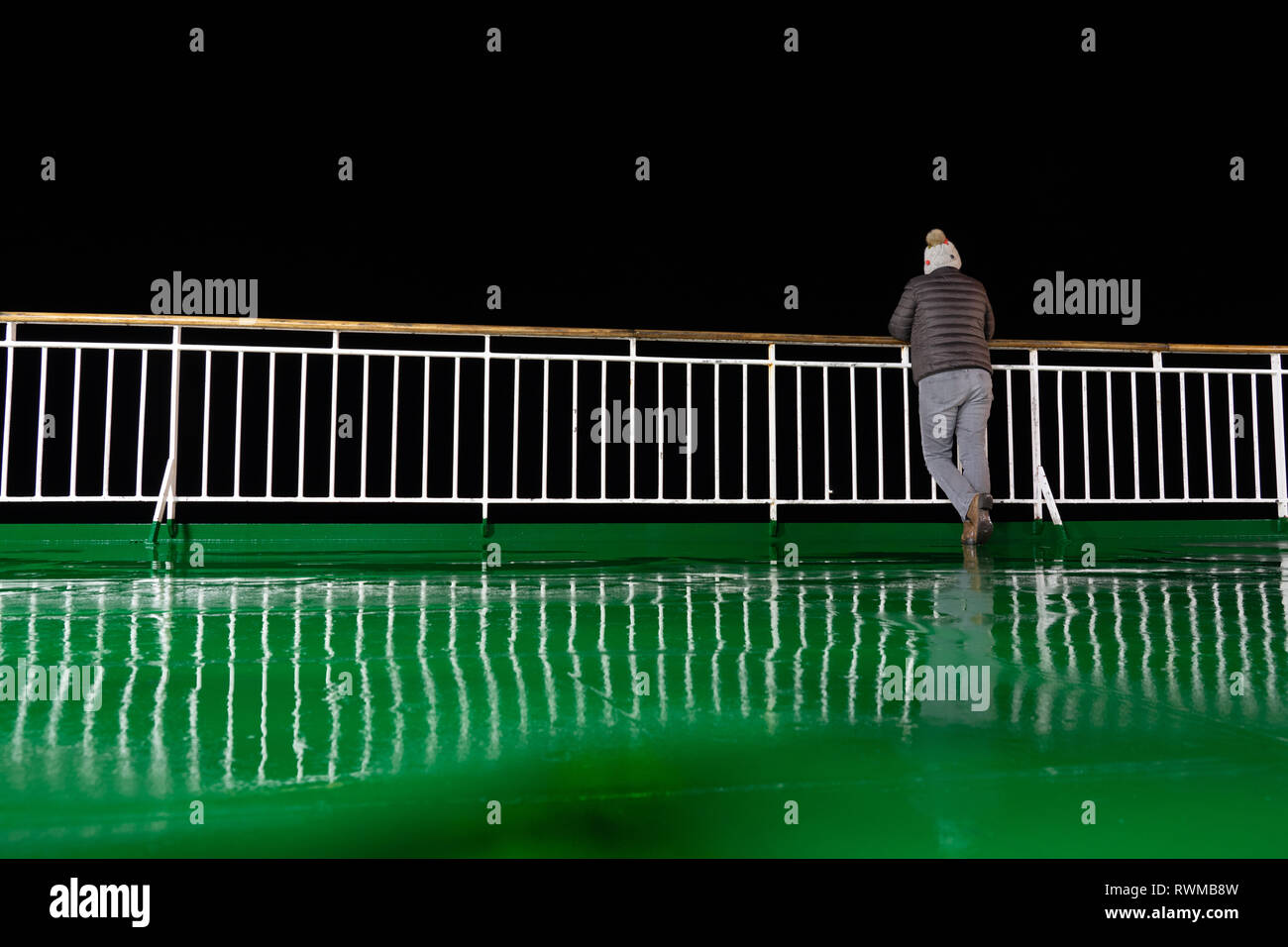 Lonely night ferry crossing Stock Photo