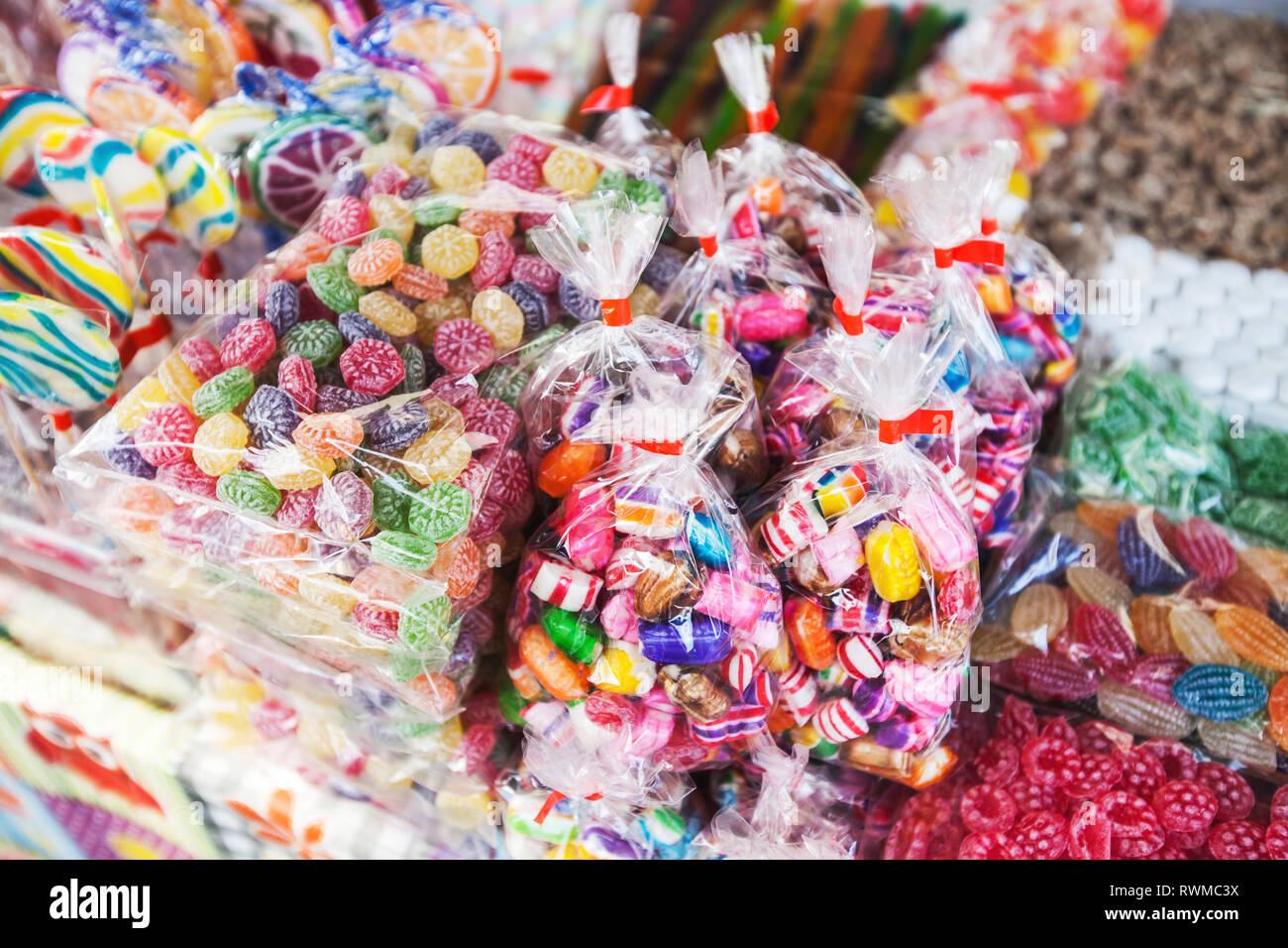 selection of colorful sweets confectionery at candy store on open festive markets Stock Photo