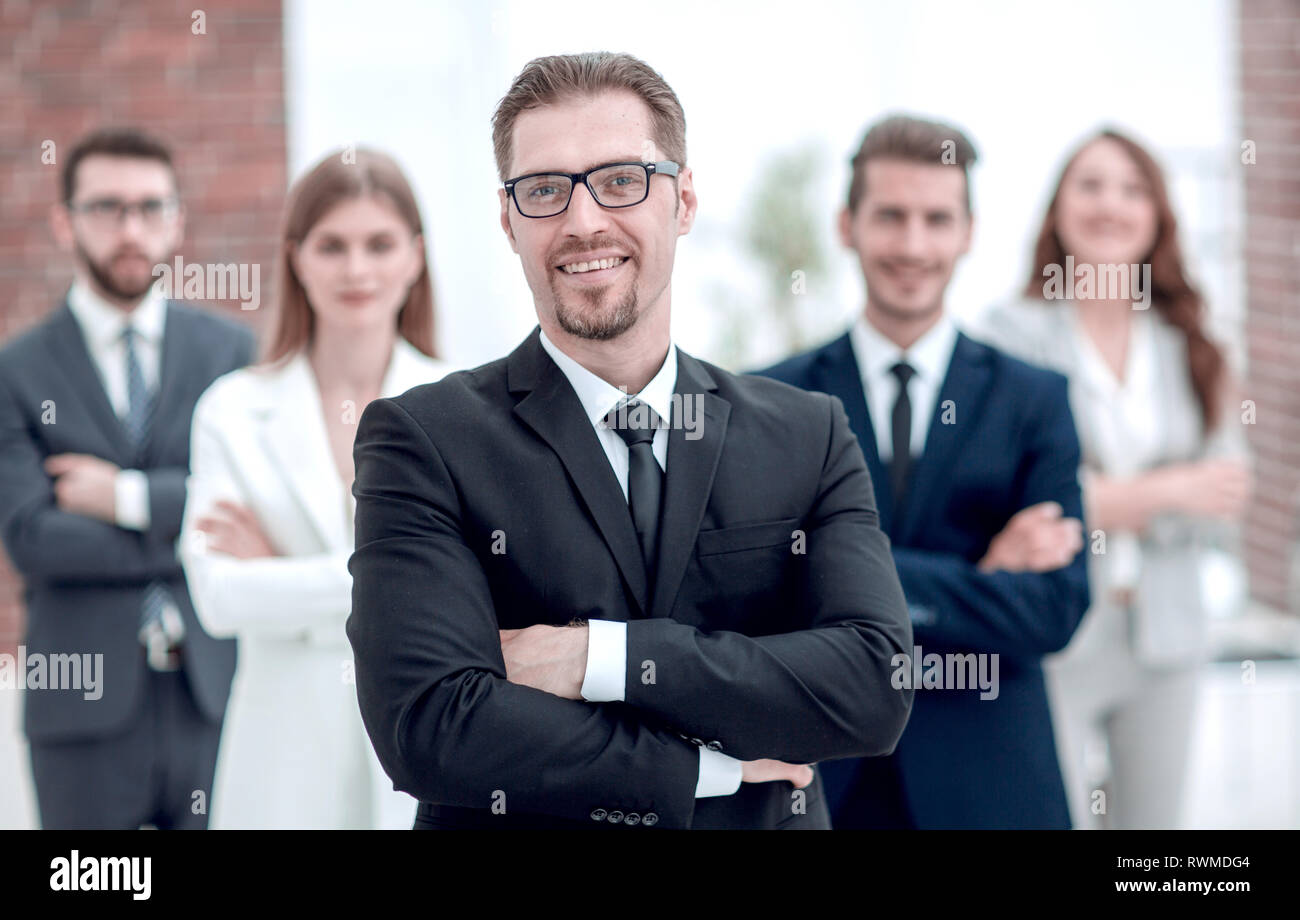 confident businessman in front of his business team Stock Photo - Alamy