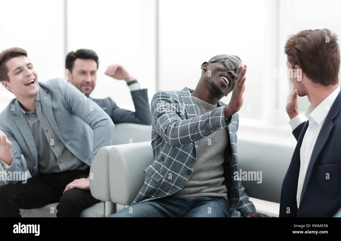 close up.cheerful co-workers giving each other a high five Stock Photo
