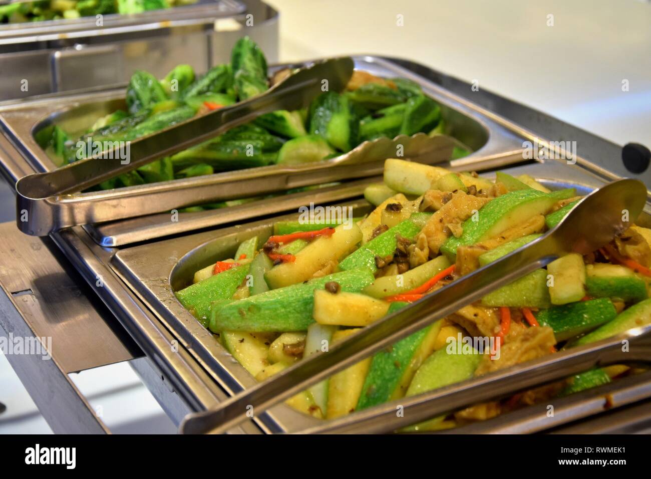 Cuisine Culinary Buffet in chinese vegetarian restaurant. Fried luffa gourd  Stock Photo - Alamy