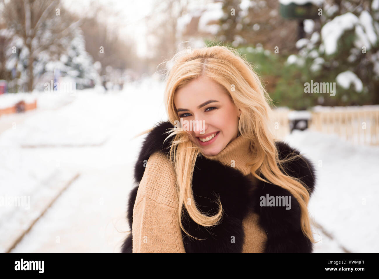 Outdoor close up photo of young beautiful happy smiling girl walking on ...