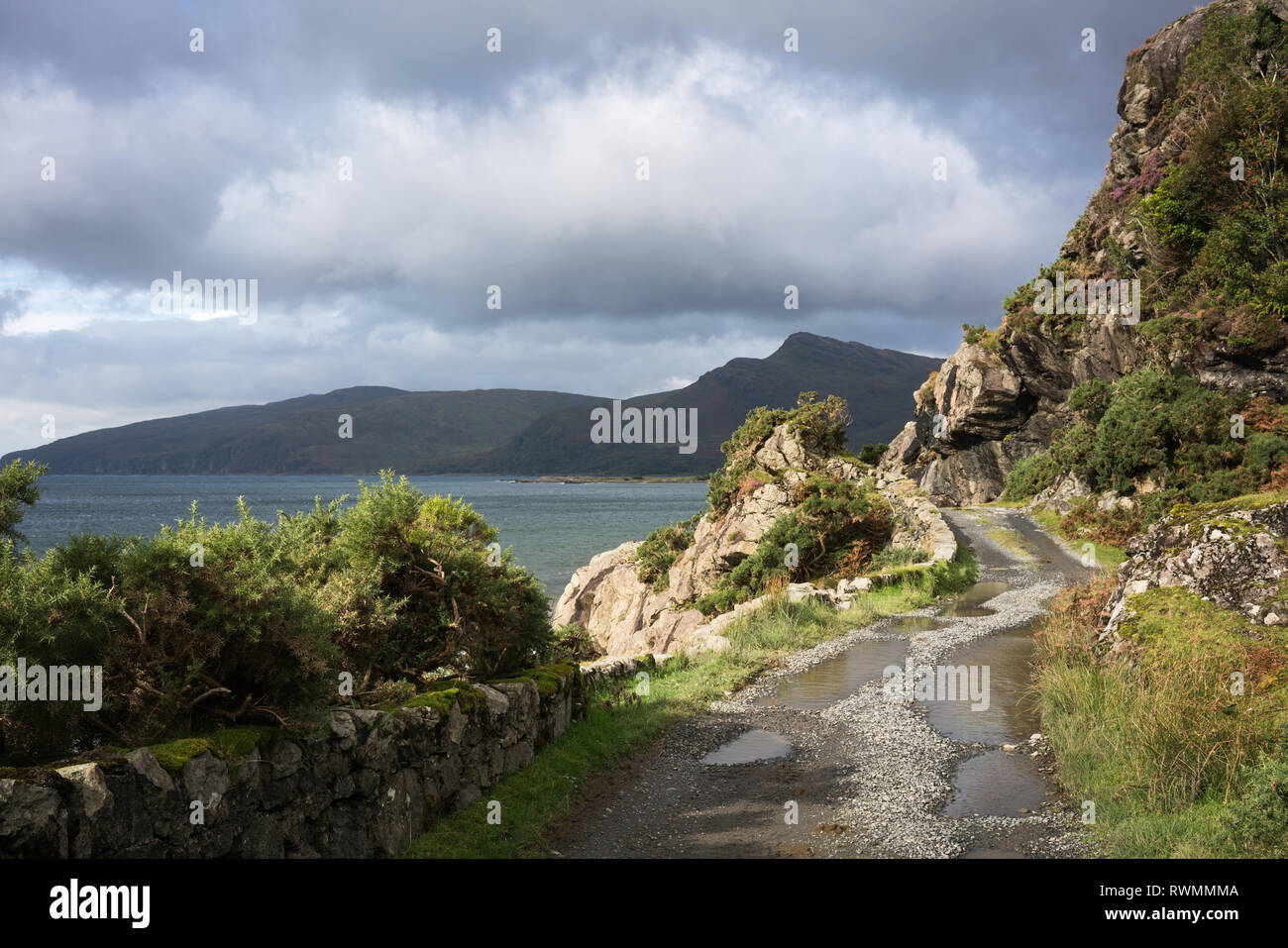 Looking across Loch Buie to Beinn nan Gobhar from a rocky farm track above the loch. Stock Photo