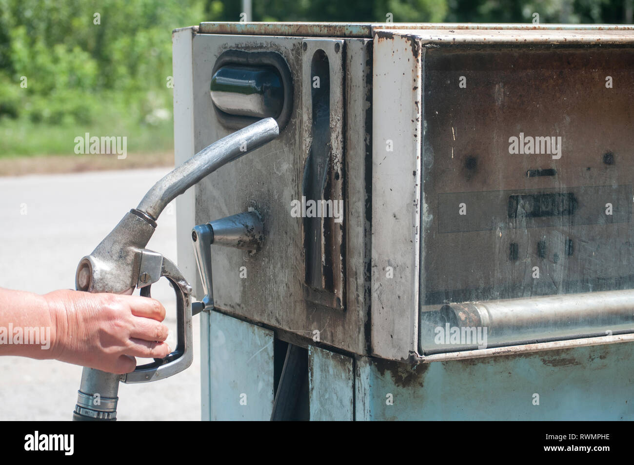 Old abandoned vintage obsolete petrol fuel gas dispenser in former