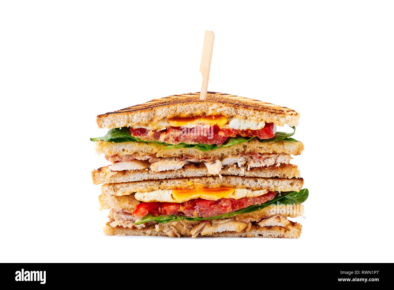 Huge juicy club sandwich with chicken and fried egg on white Stock Photo