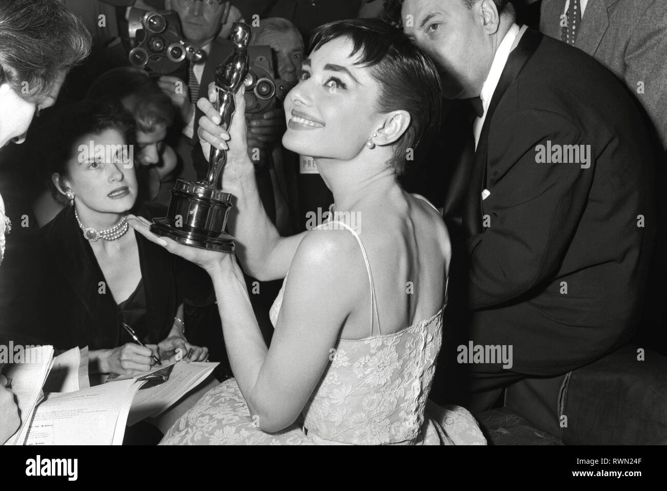 Audrey Hepburn wearing a white floral dress by Hubert de Givenchy at the 26th Annual Academy Awards held at the NBC Century Theatre in New York City on March 25, 1954. Hepburn won best actress for 'Roman Holiday'  File Reference # 33751 482THA Stock Photo