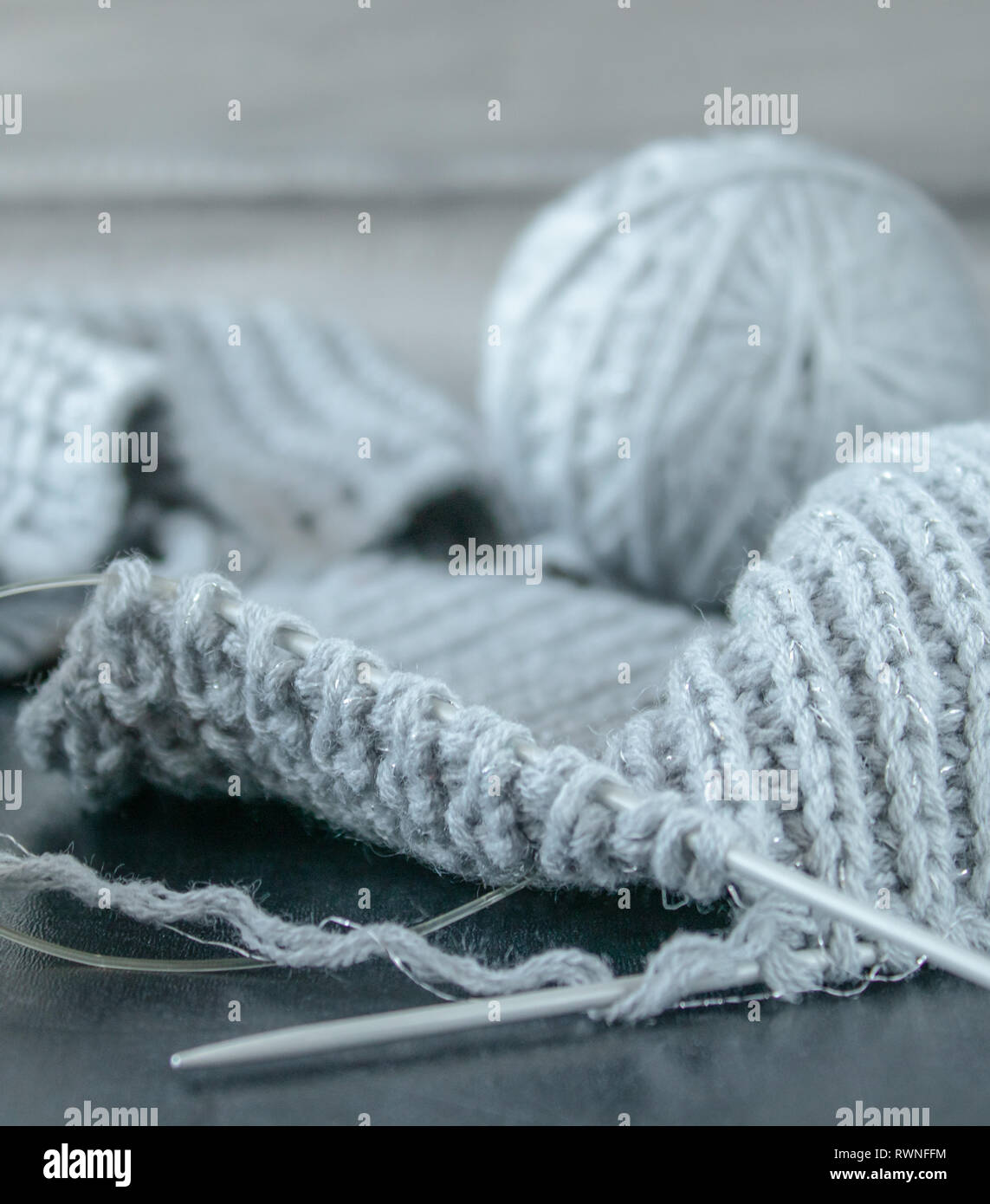 Knitted products on a black background close-up. Stock Photo